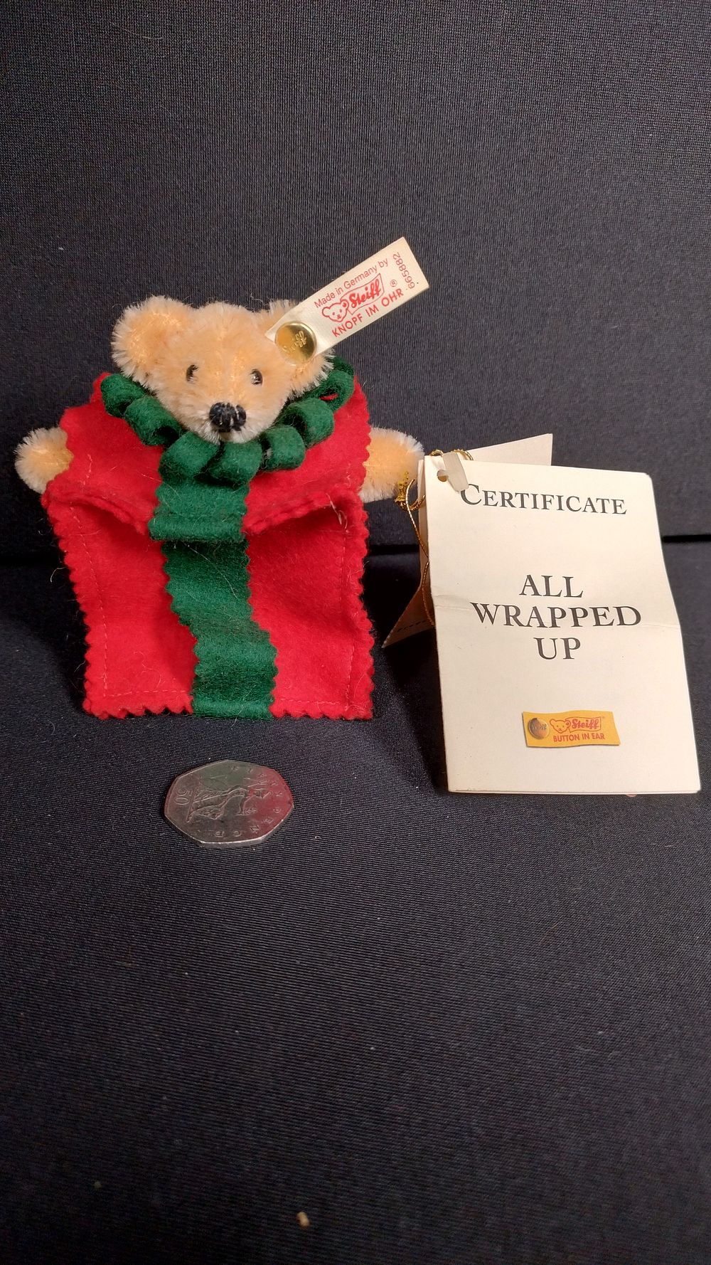 Lot 299: Steiff 1999 All wrapped up bear measures 4...