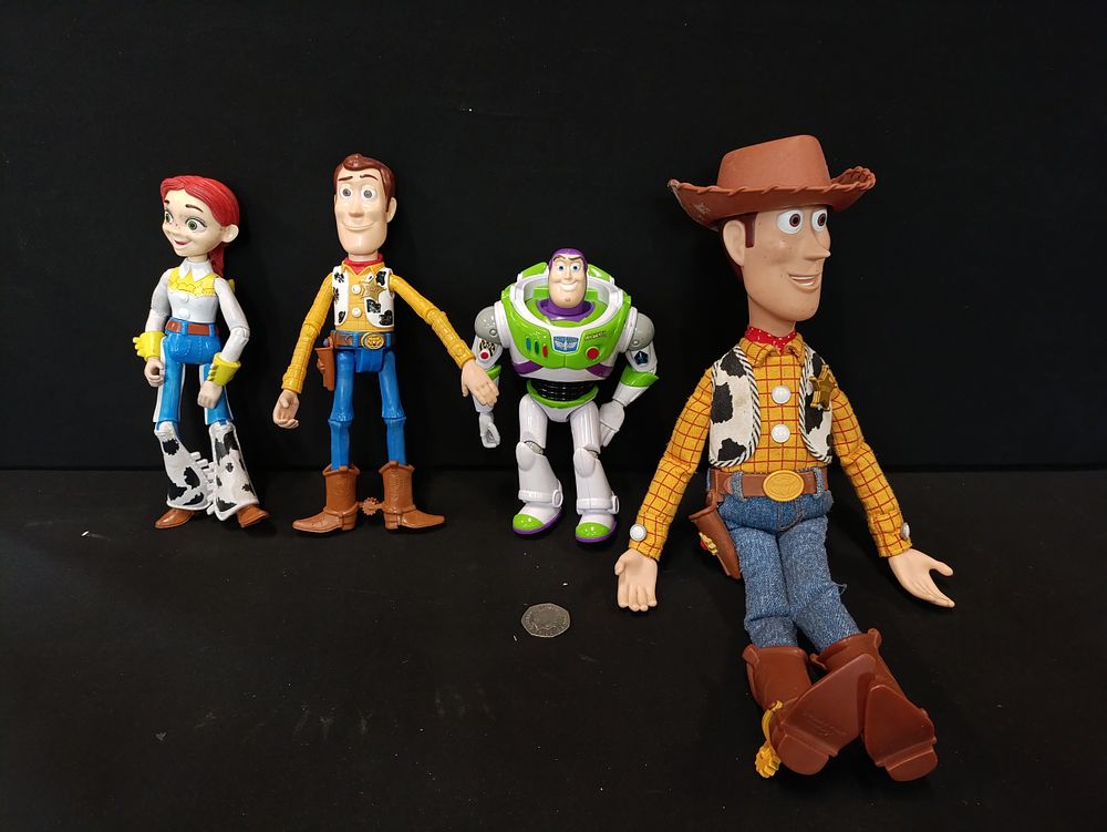 Lot 312: Collection of toy story figures including Woody, Buzz...