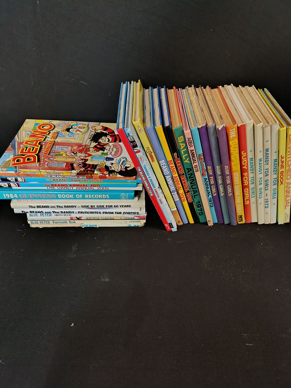 Lot 319: Collection of comic annuals including Beano, Dandy, Sindy...