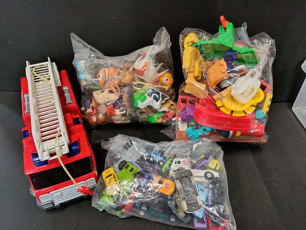 Lot 338: Selection of toys including a fire engine, numerous...