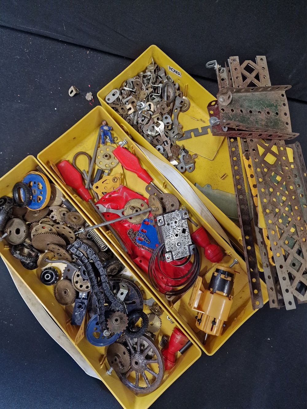 Lot 385: Three boxes of vintage diecast MECCANO parts. All...