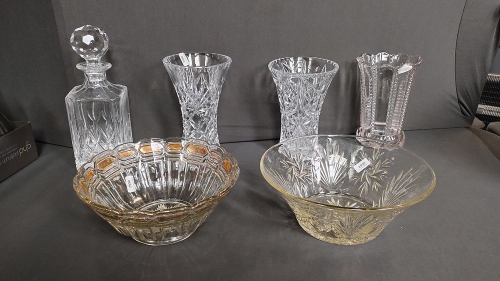 Lot 406: Selection of cut crystal, three vases, a heavy...