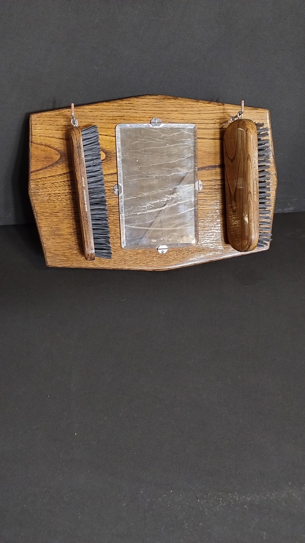 Lot 103: vintage clothes brushes mounted on wooden plaque with...