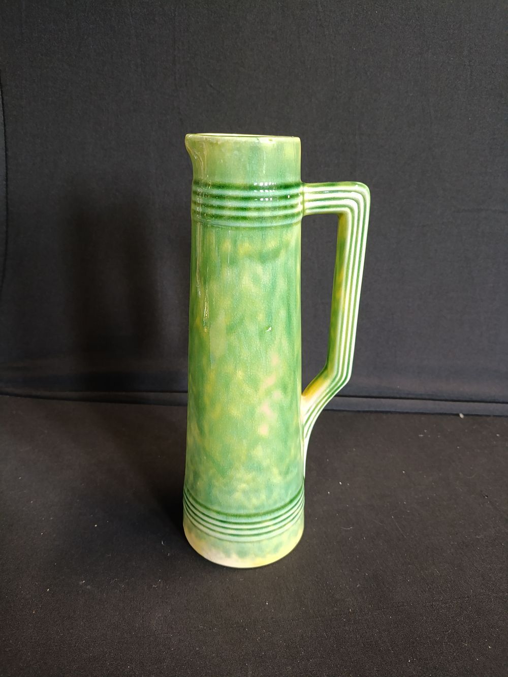 Lot 136: Vintage green stoneware pitcher. West German no.788-313. Approximately...