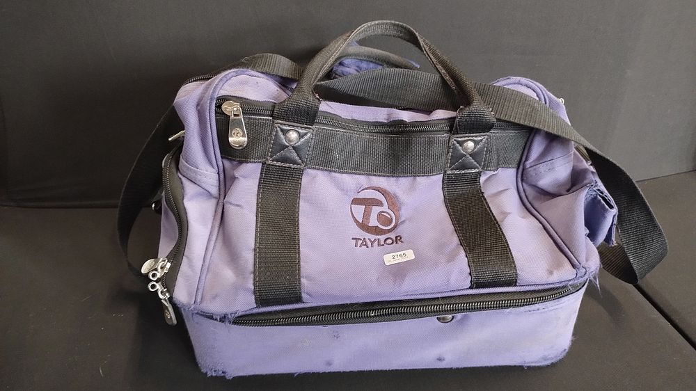 Lot 191: Taylor crown green bowling bag with two Drakes...