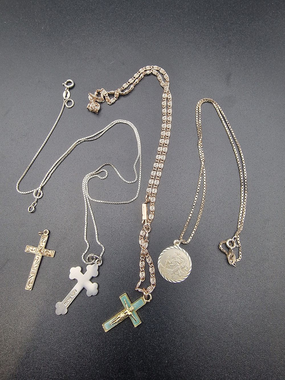 Lot 209: Four pieces es of vintage religious jewellery. Three...