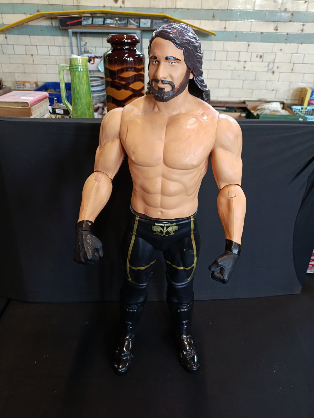 Lot 301: Jakks Pacific WWE Seth Rollins Action Figure approximately...