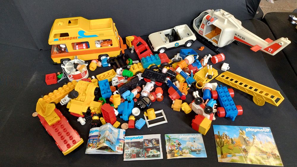Lot 364: Collection of vintage Playmobil items including camper, helicopter,...