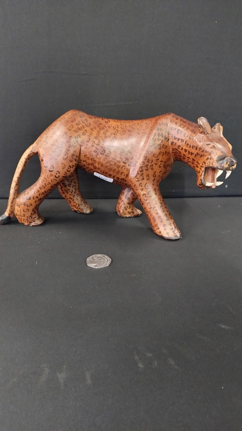 Lot 390: Wooden leopard measures approximately H14.5 x L30 cm