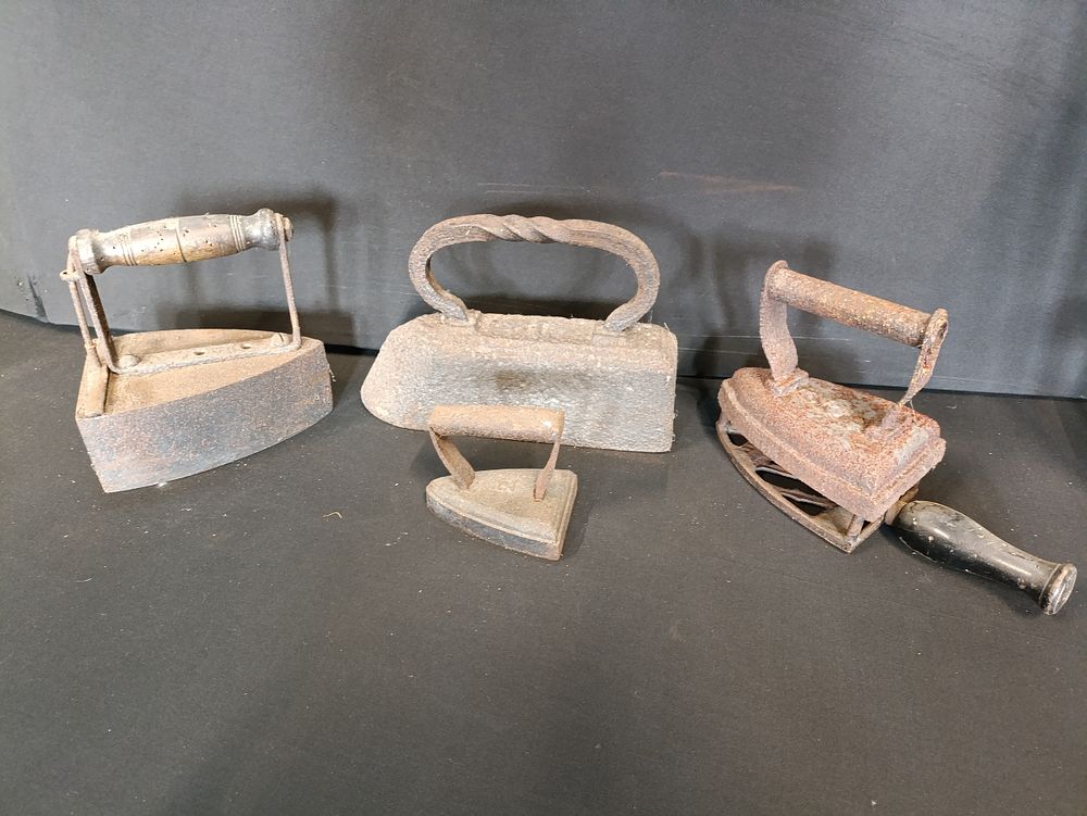 Lot 54: 4 vintage cast iron, flat irons