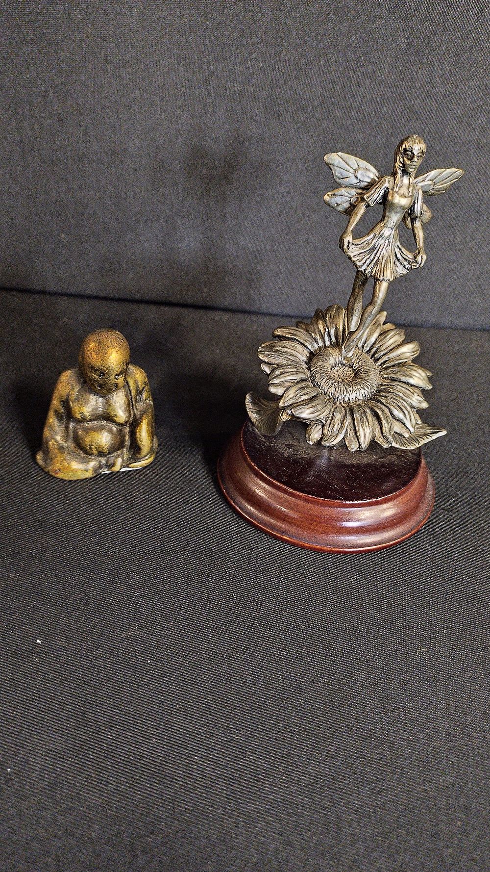 Lot 124: Miniature brass Buddha, and a metal fairie on...