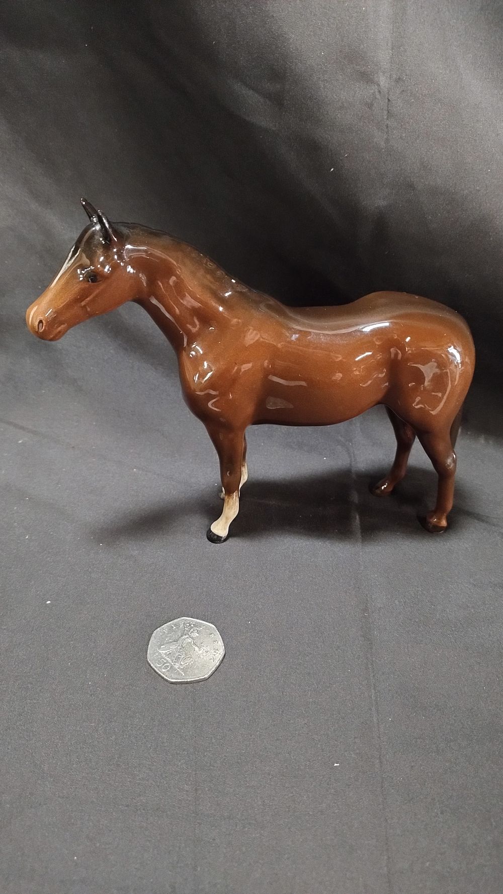 Lot 128: Beswick brown thoroughbred with white blaze and socks....