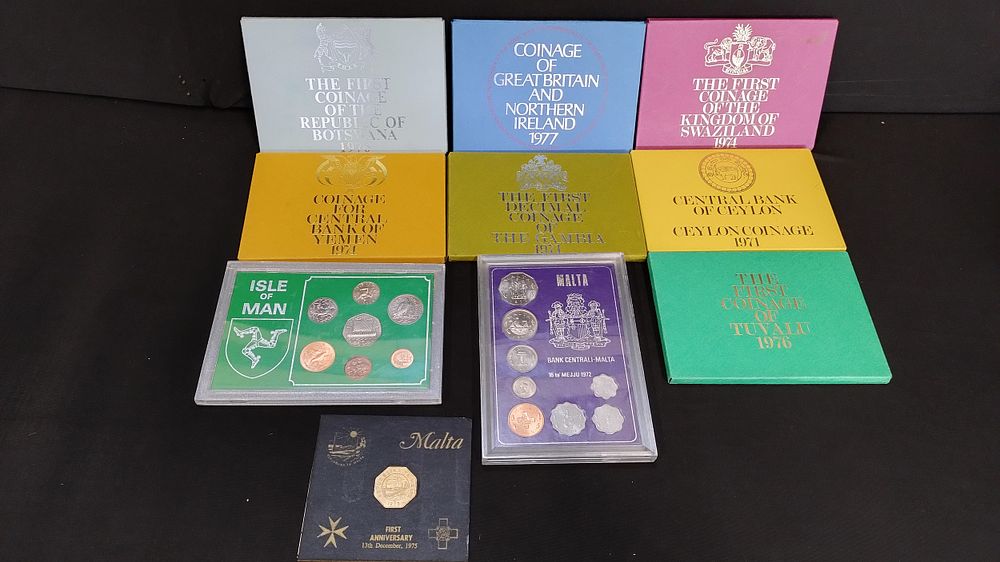 Lot 145: 10 collectors coin packs from various countries and...
