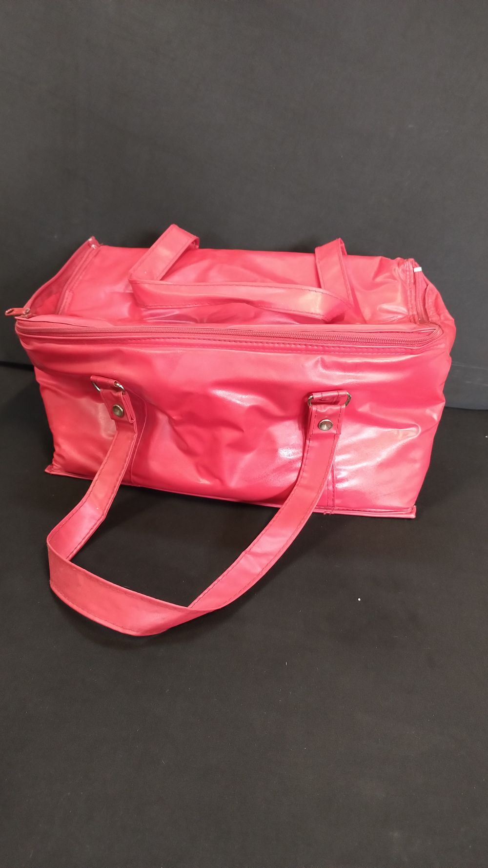 Lot 148: Red zip bag containing 2 crown green bowls