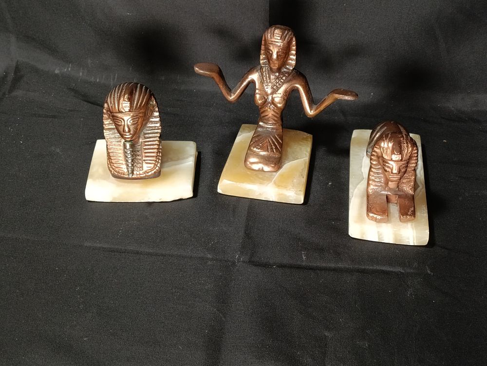 Lot 238: 3 copper Egyptian figurines on Onyx bases including...