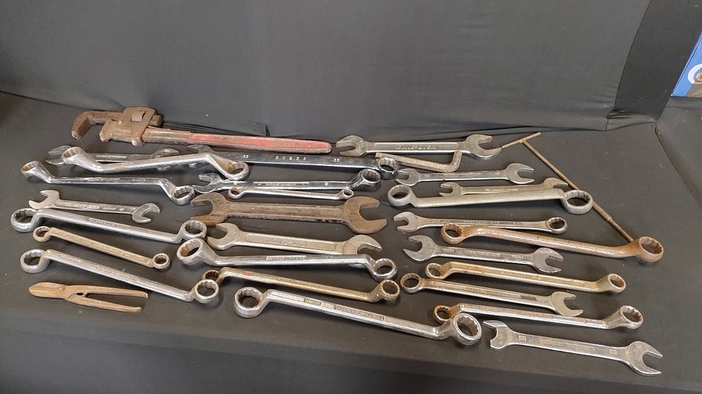 Lot 245: Bag of assorted wrenches and a large adjustable...
