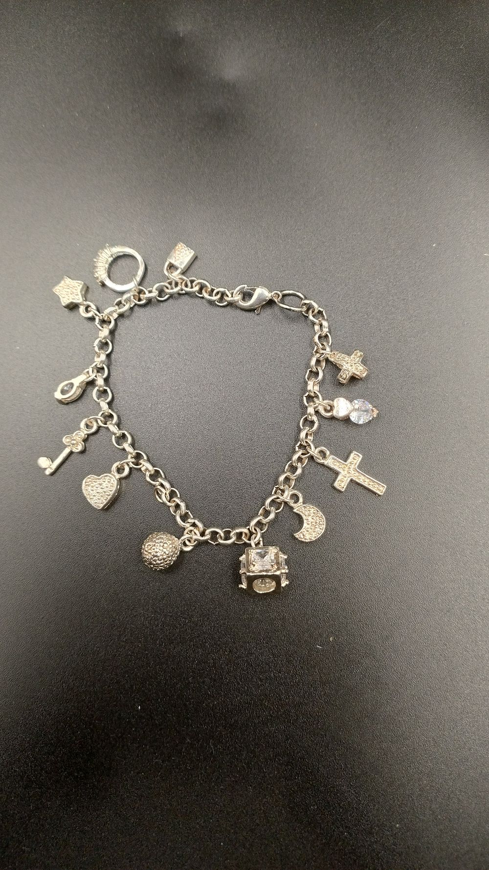 Lot 301: Sterling Silver Charm Bracelet With 12 pendant charms