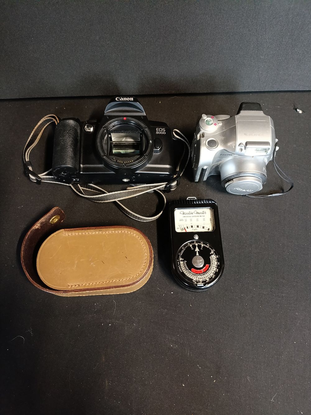 Lot 403: Canon film camera, Fujifilm digital camera and a...