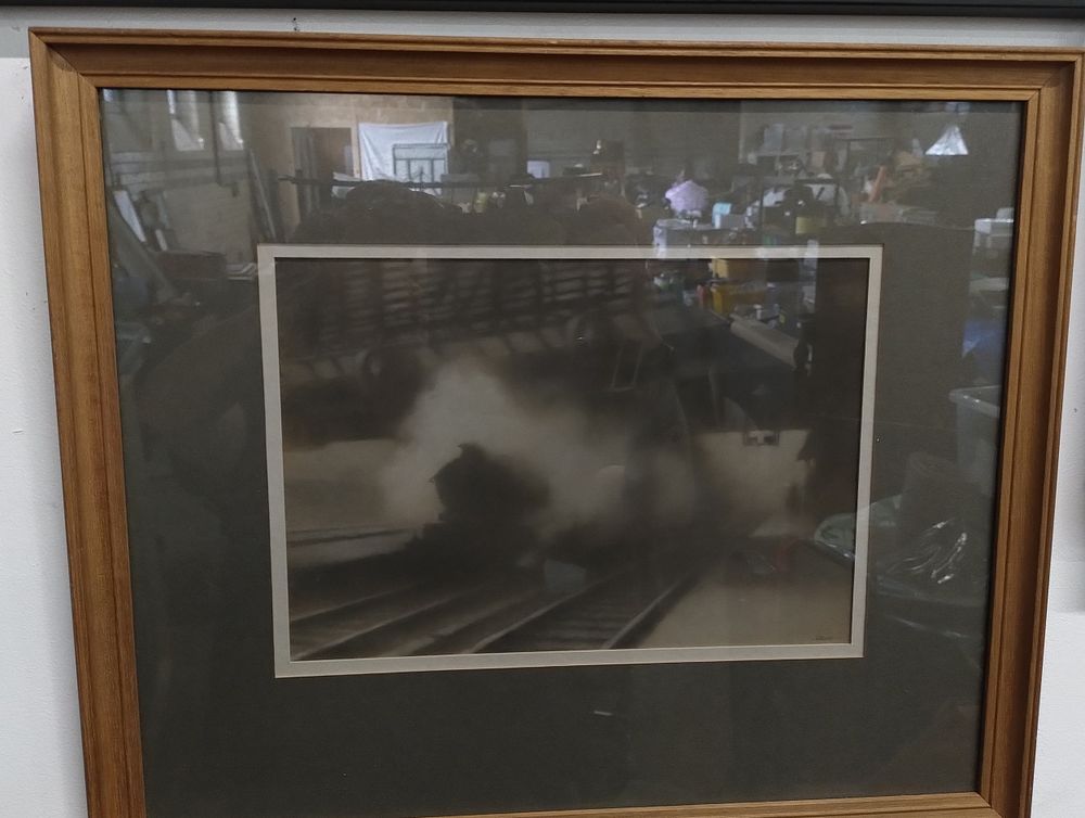 Lot 439: Paddington Departure of a steam train framed black...