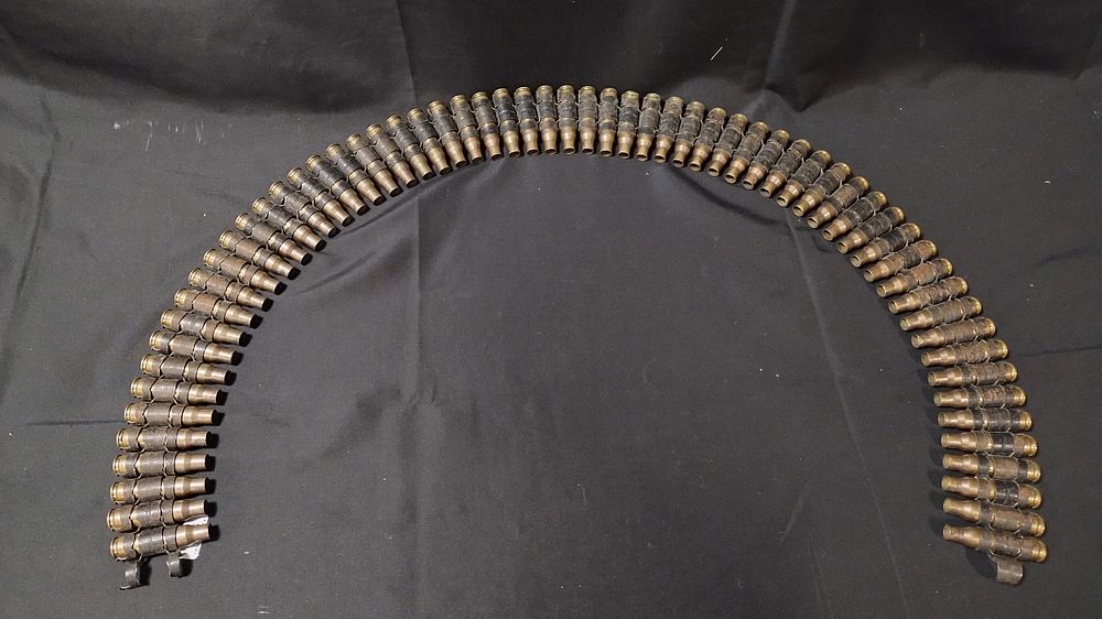 Lot 443: Vintage military 95 cm 62 bullet casing belt