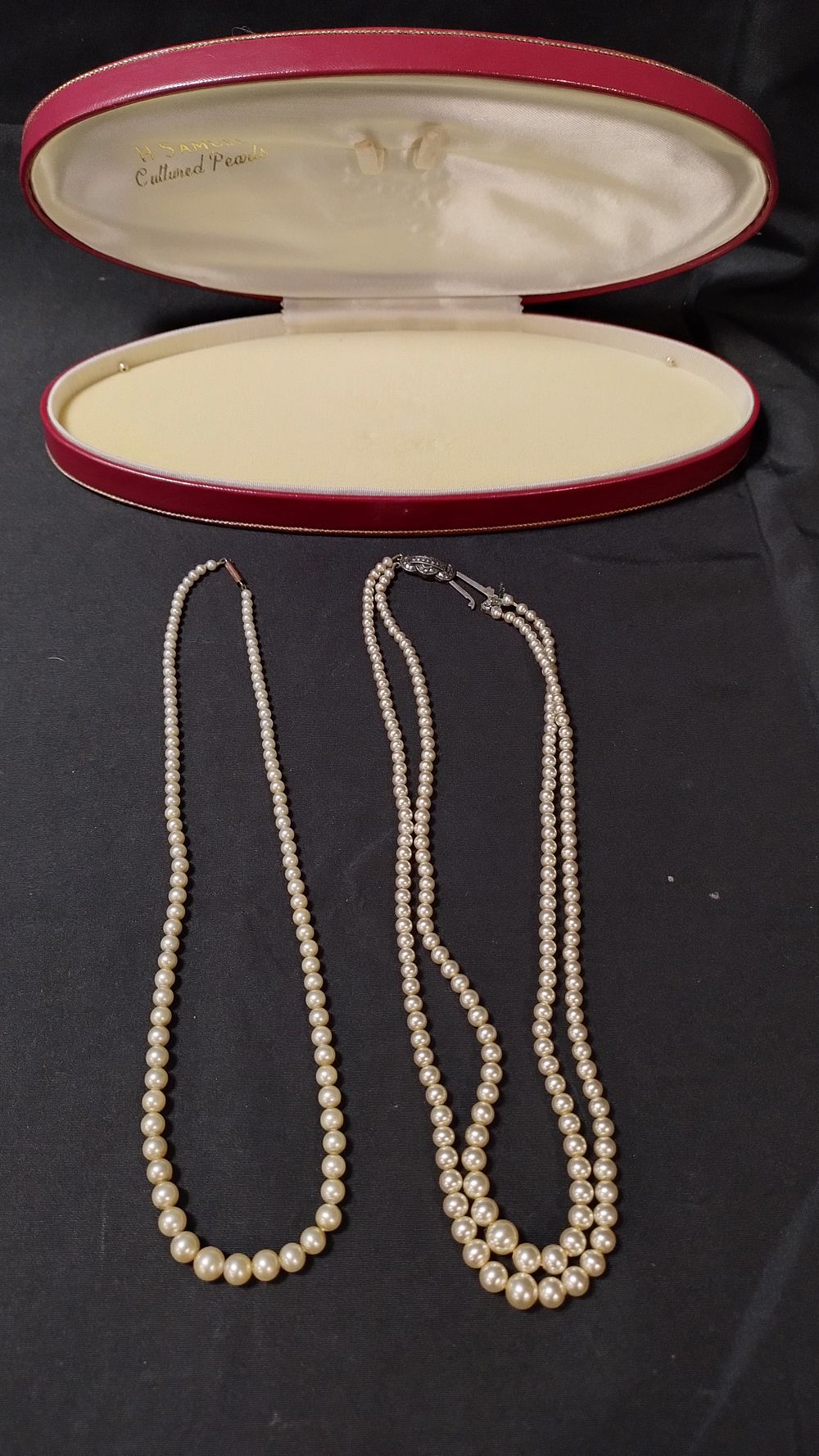 Lot 447: 2 strings of pearls one has a 9ct...