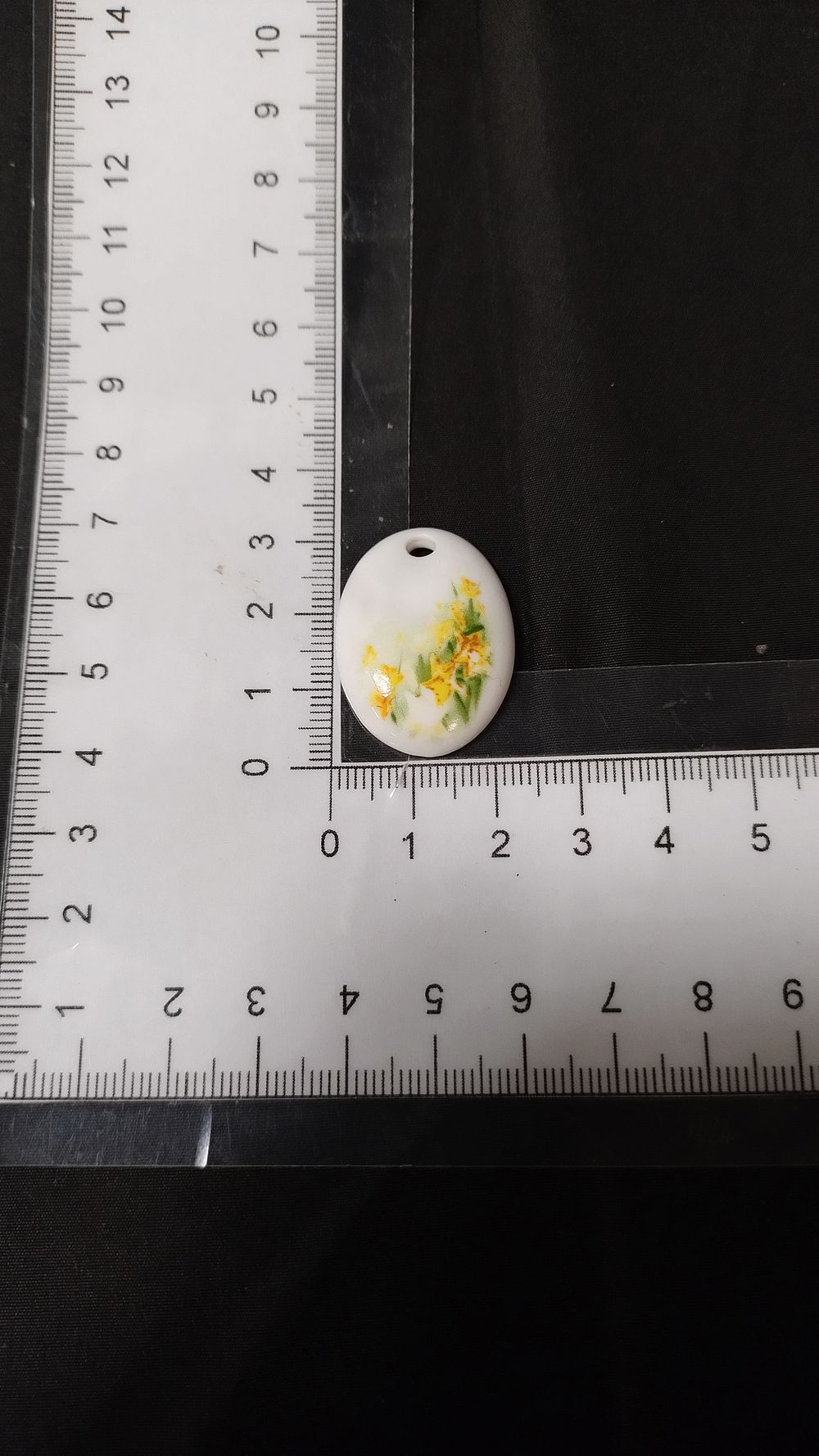 Lot 449: Limoges Porcelain pendant with daffodil decorations Measures approx...