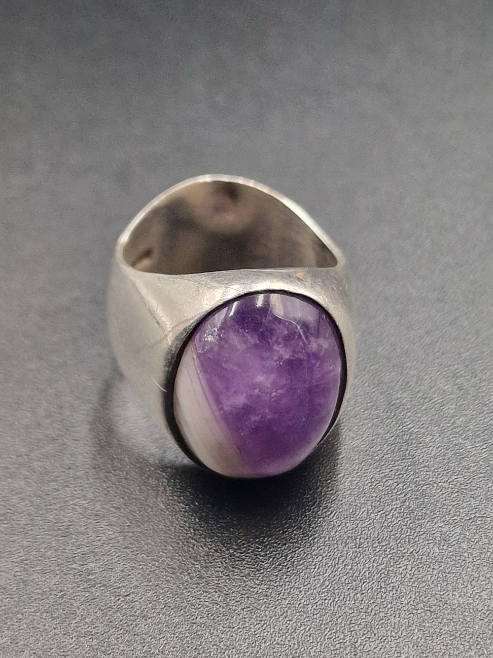 Lot 459: A chunky, thick banded sterling silver and amethyst...