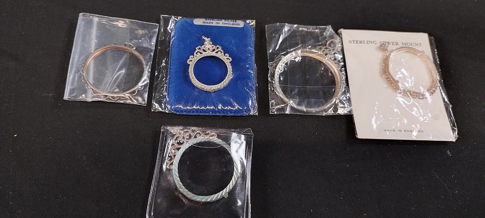 Lot 471: 5 Sterling silver pendant mounts