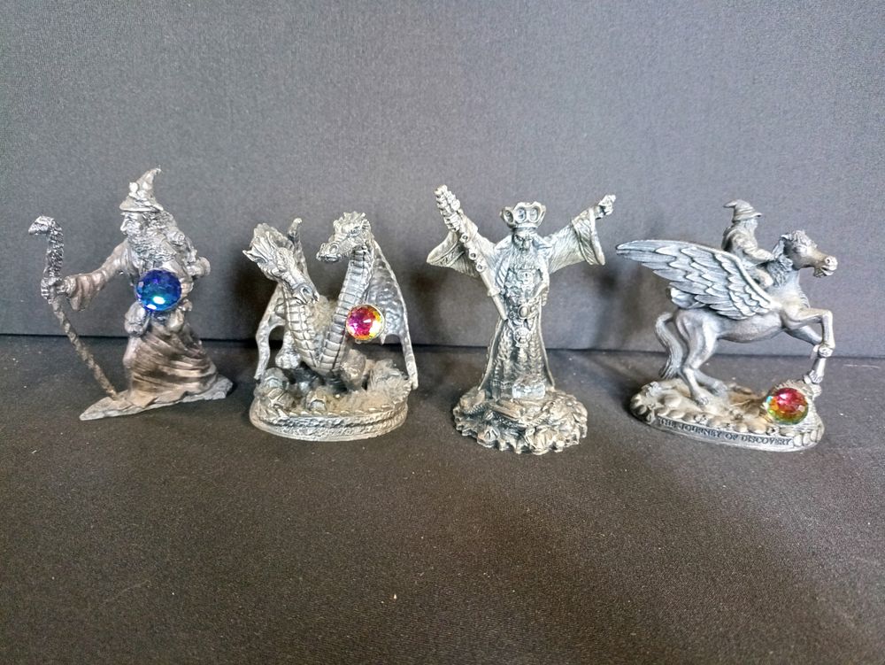 Lot 229: Four Myth and Magic dragon and wizard metal...
