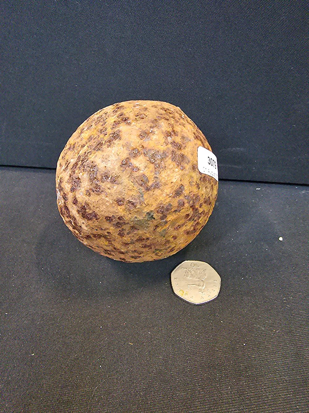 Lot 61: Antique cannonball.