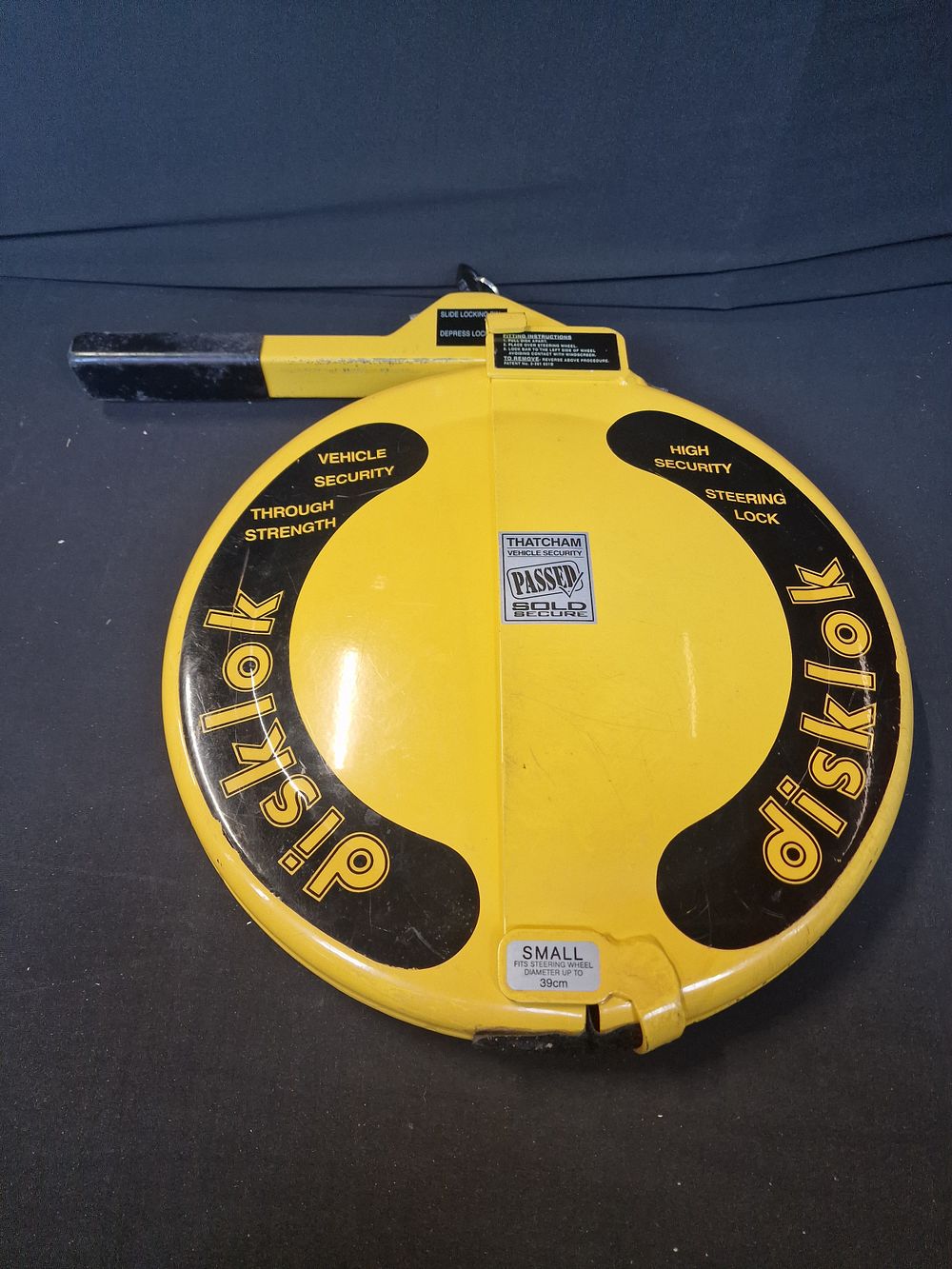 Lot 70: Disklok Steering Wheel Lock. Size Small Fits Steering...
