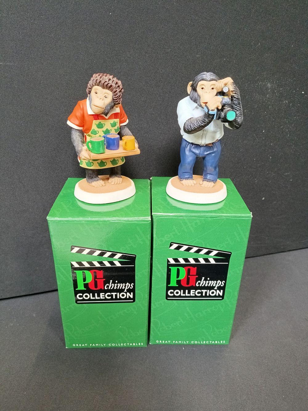 Lot 128: Two boxed collectable figurines from the PG Chimps...
