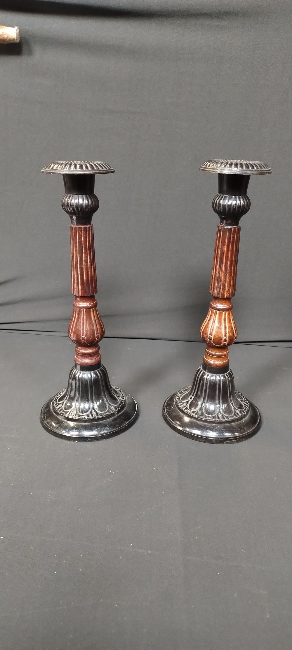 Lot 138: Pair of metal and enamel candle holders. features...