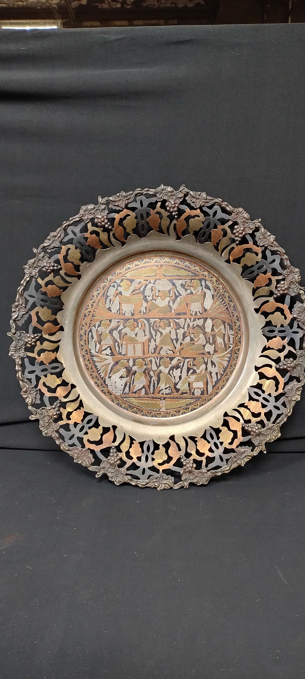 Lot 145: Egyptian brass and copper wall plaque with grape...