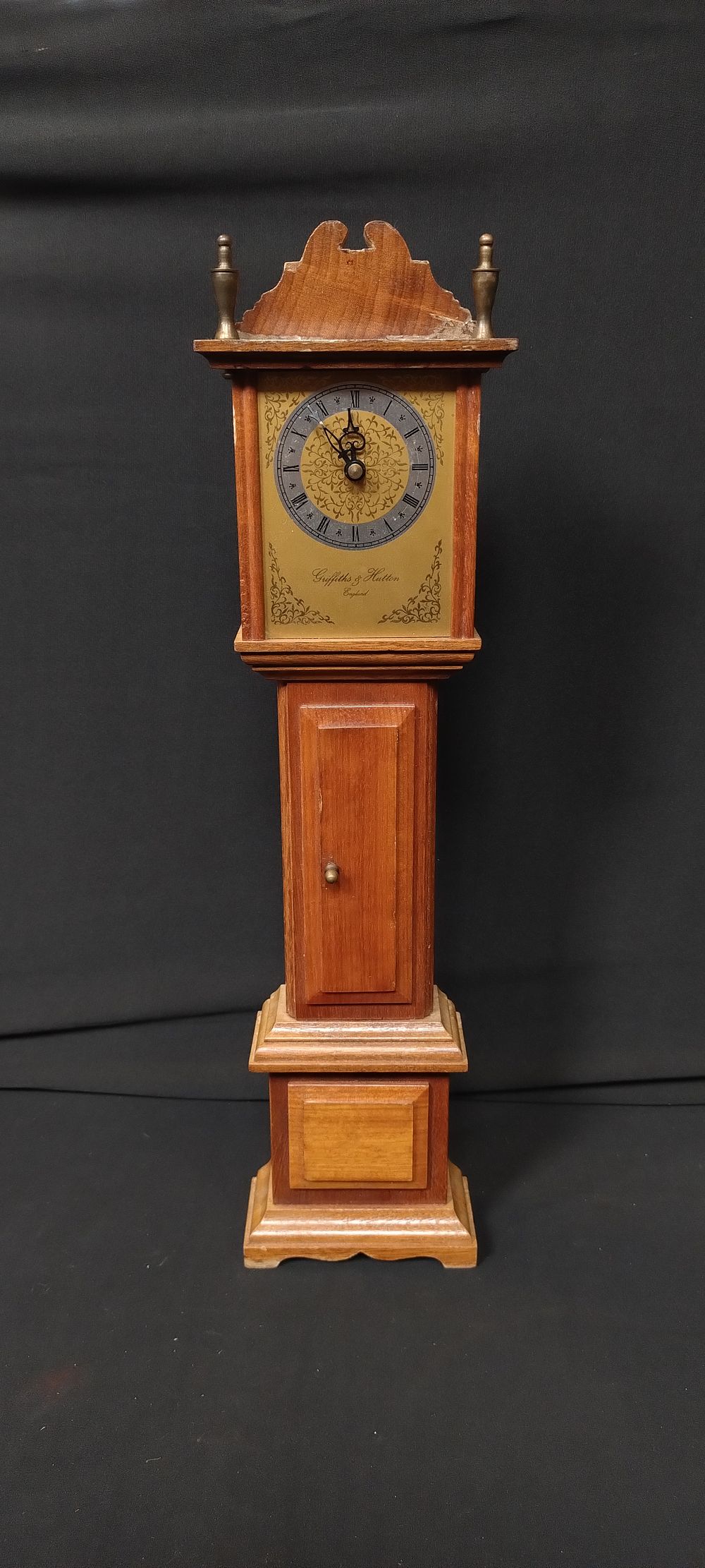 Lot 152: Battery operated miniature clock with wooden framework. Measures...