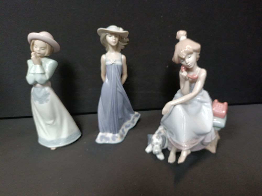 Lot 167: Two Lladro figurines (chit chat girl and Susan)...