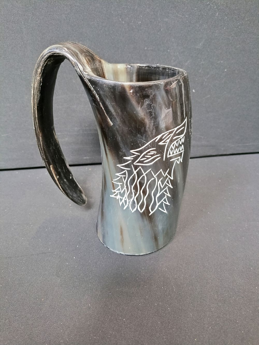 Lot 198: Viking style drinking horn with a wolf design...