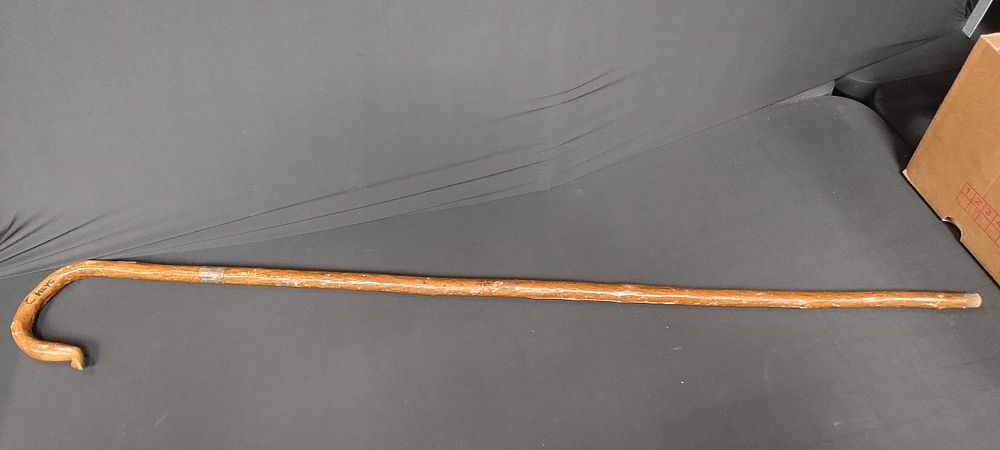 Lot 206: Hooked walking stick with a silver collar measures...