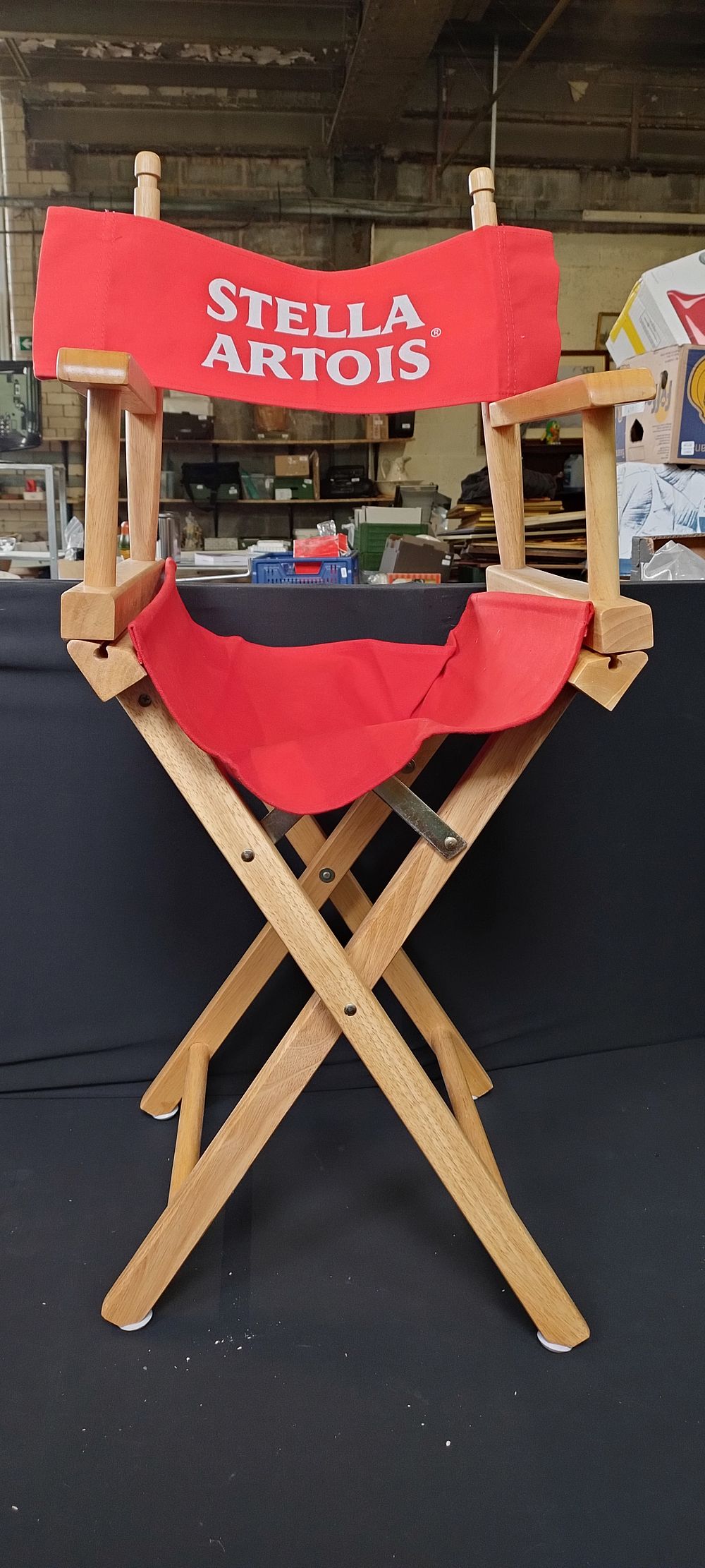 Lot 218: Commodores chair with red Stella Artois back signage....