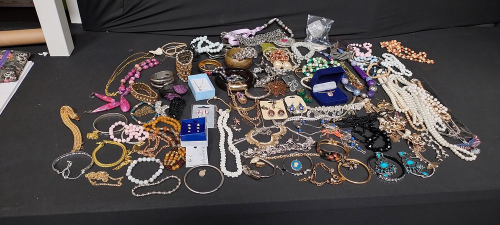 Lot 231: Large mixed jewellery items including necklaces, bangles, and...