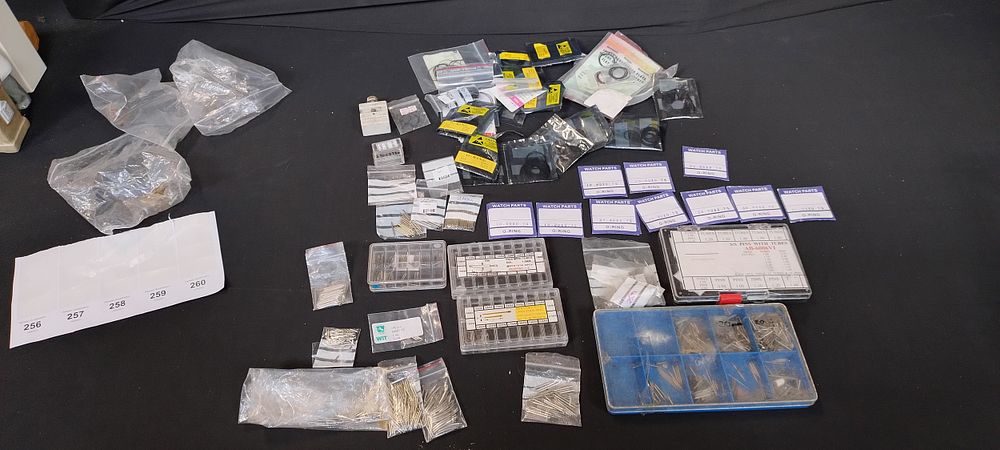 Lot 256: Various watch repairs items including o' rings, pins...
