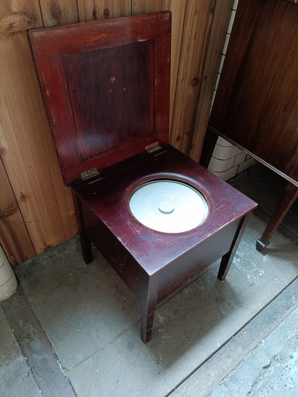 Lot 313: Antique Mahogany commode With Original Porcelain Inset