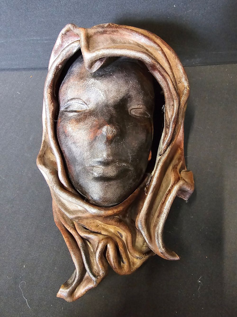 Lot 380: An Italian leather hand made wall art mask.