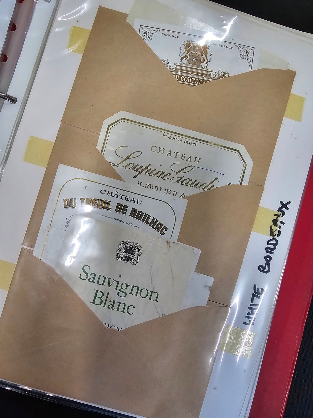 Lot 384: A large collection bottle labels a worldwide collection.