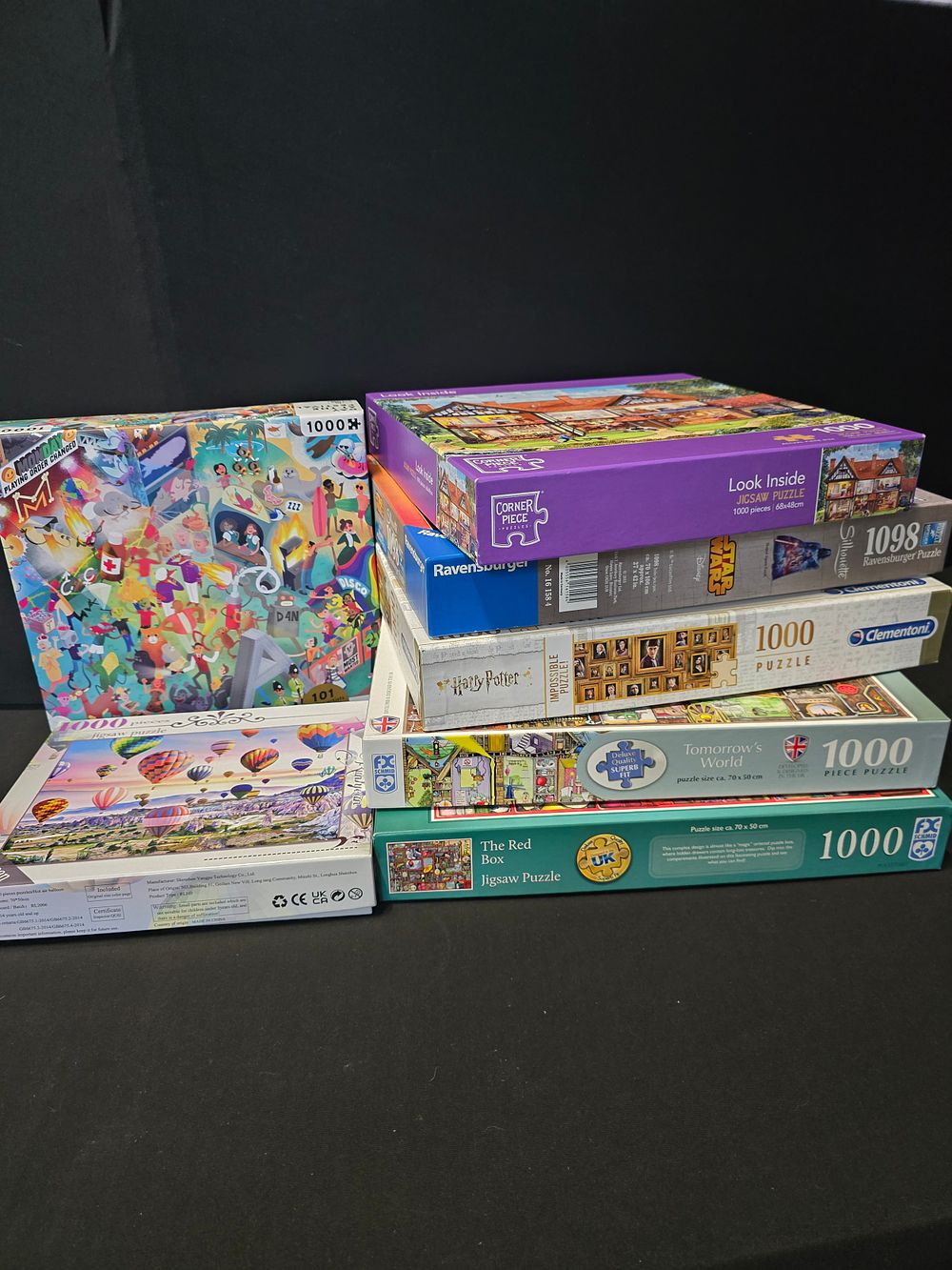 Lot 387: A collection of jigsaw puzzles. Includes Harry Potter,...