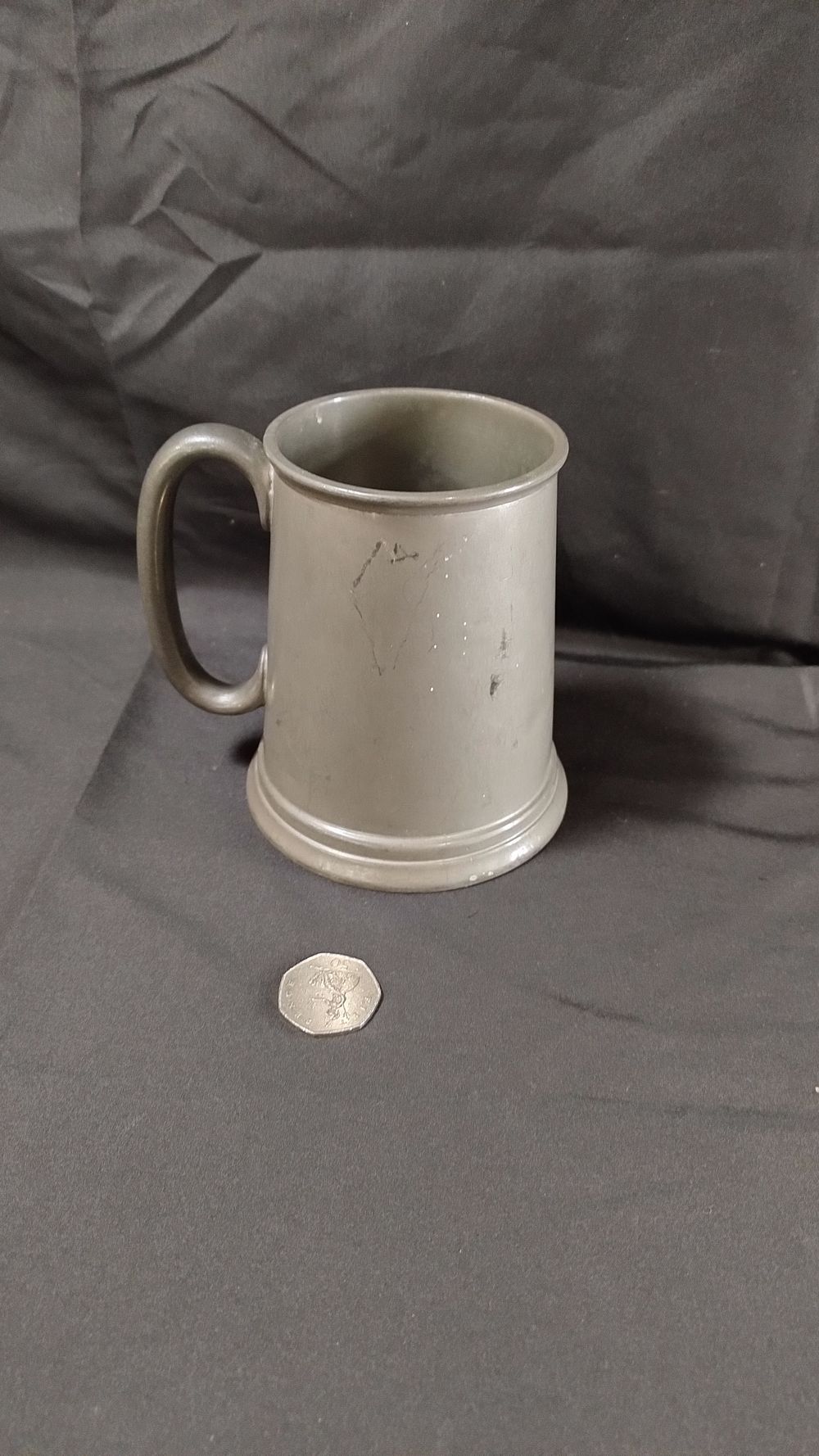 Lot 396: Cornish Pewter tankard with red etched dartboard glass...