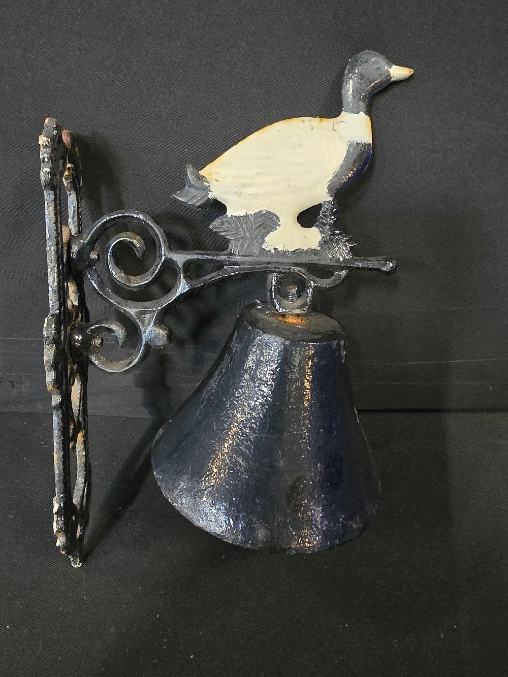 Lot 463: Cast iron wall hanging door bell.