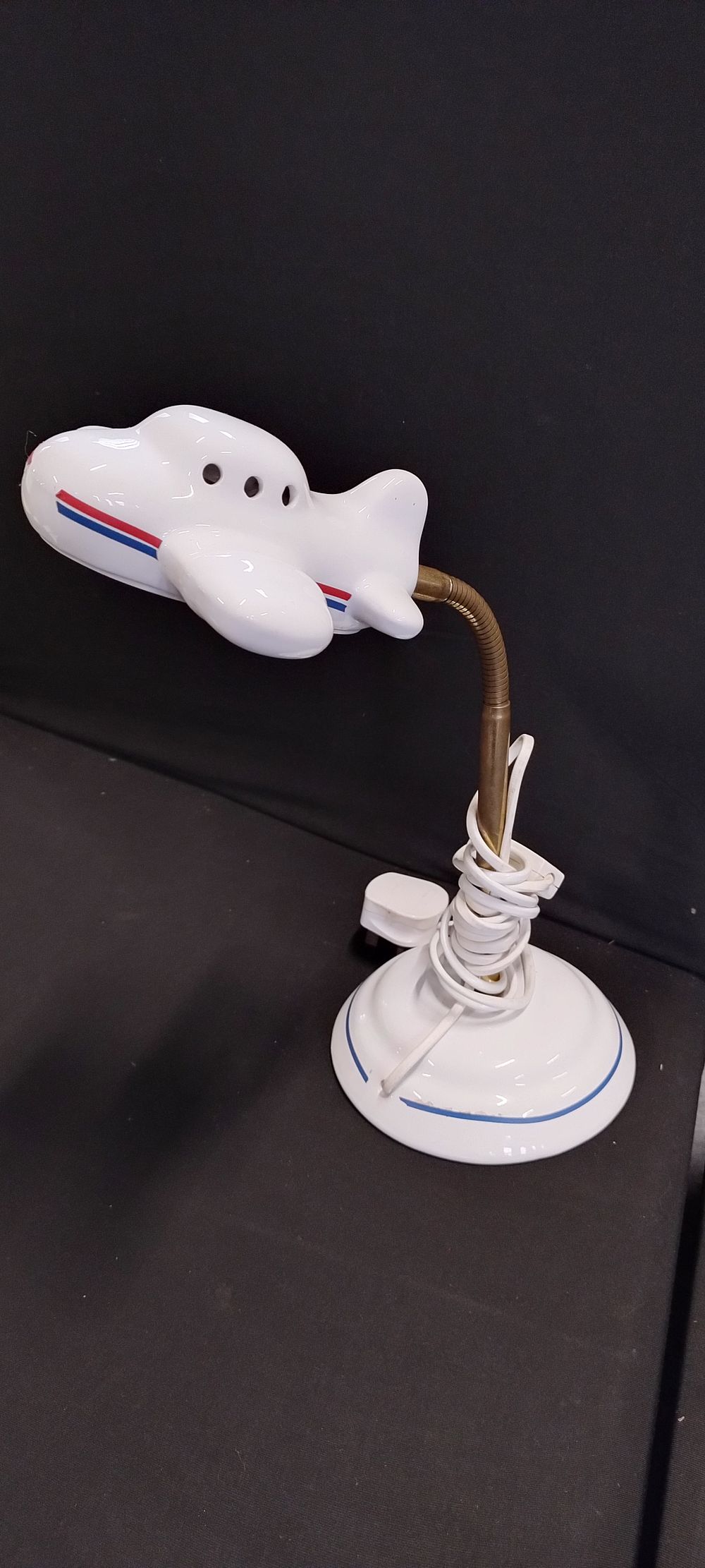 Lot 374: Porcelain aeroplane poise lamp tested for power