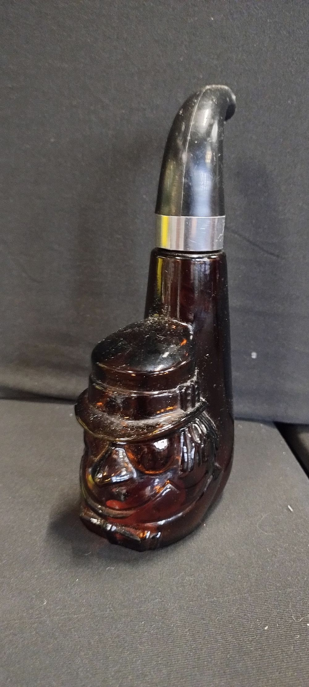 Lot 375: Vintage brown glass bottle in a pipe shape...