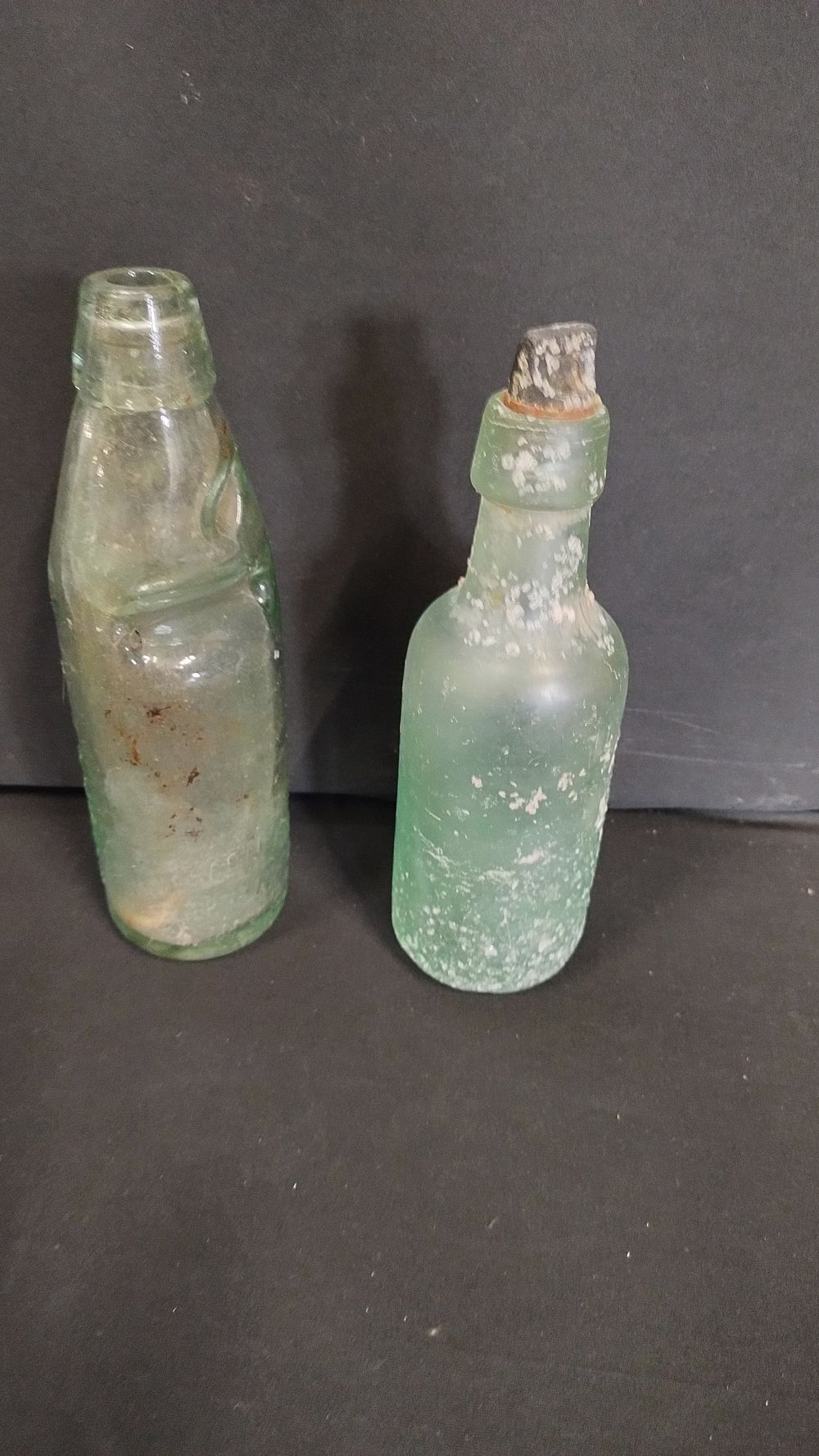 Lot 454: Two vintage bottles one from Swinton, covered in...